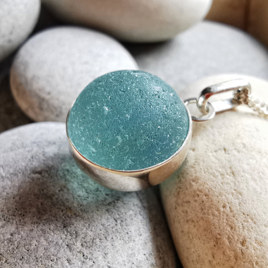Light blue sea glass marble & sterling silver pendant.