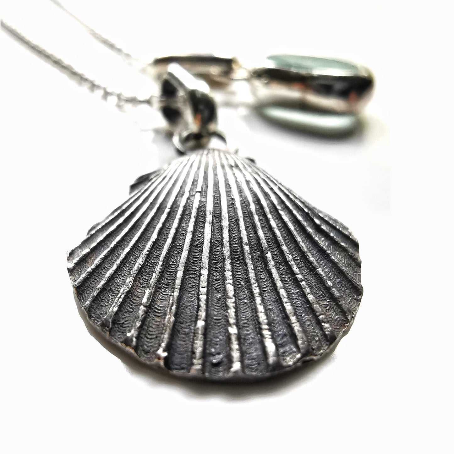 Seafoam sea glass and silver shell pendants duo.
