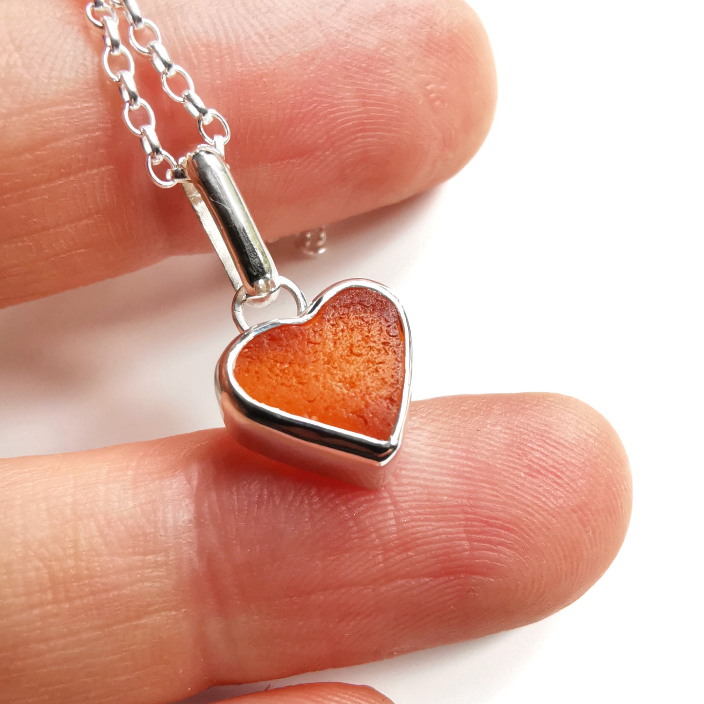 Scottish UV deep orange sea glass heart & sterling silver pendant.