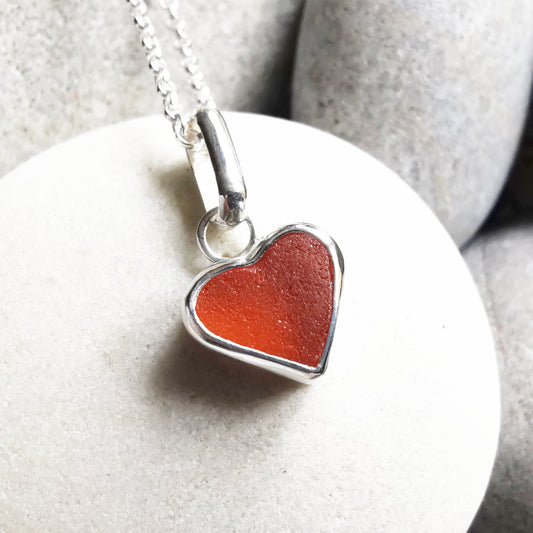 Scottish UV deep orange sea glass heart & sterling silver pendant.