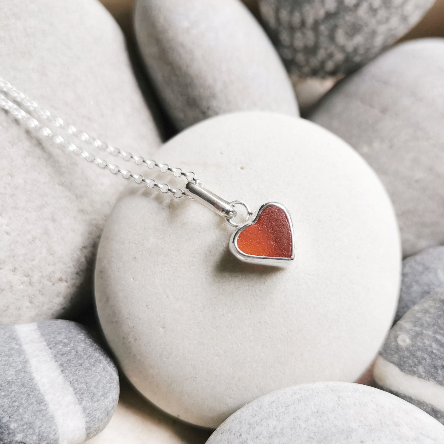 Scottish UV deep orange sea glass heart & sterling silver pendant.