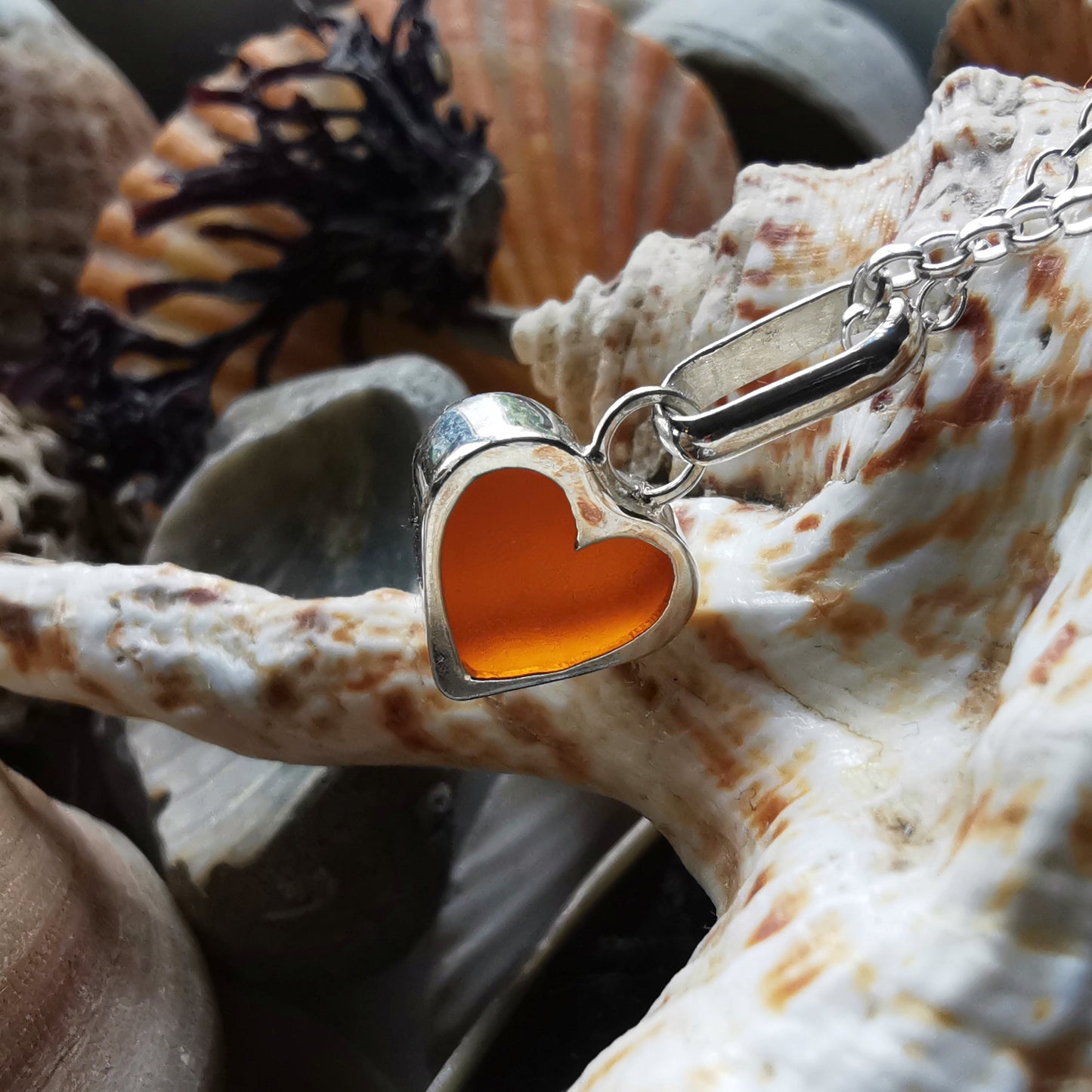 Scottish UV deep orange sea glass heart & sterling silver pendant.