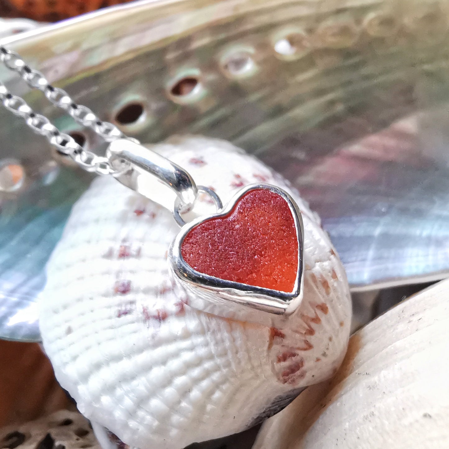Scottish UV deep orange sea glass heart & sterling silver pendant.