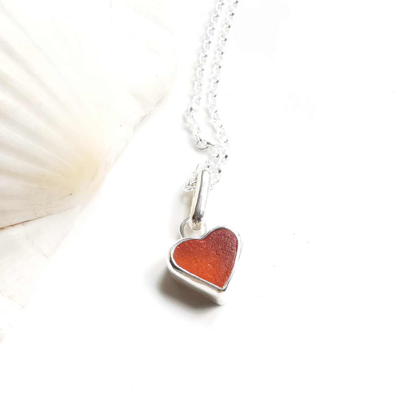 Scottish UV deep orange sea glass heart & sterling silver pendant.