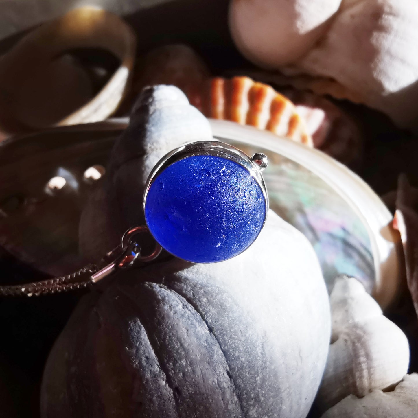 Scottish cobalt blue and white sea glass marble & sterling silver pendant.