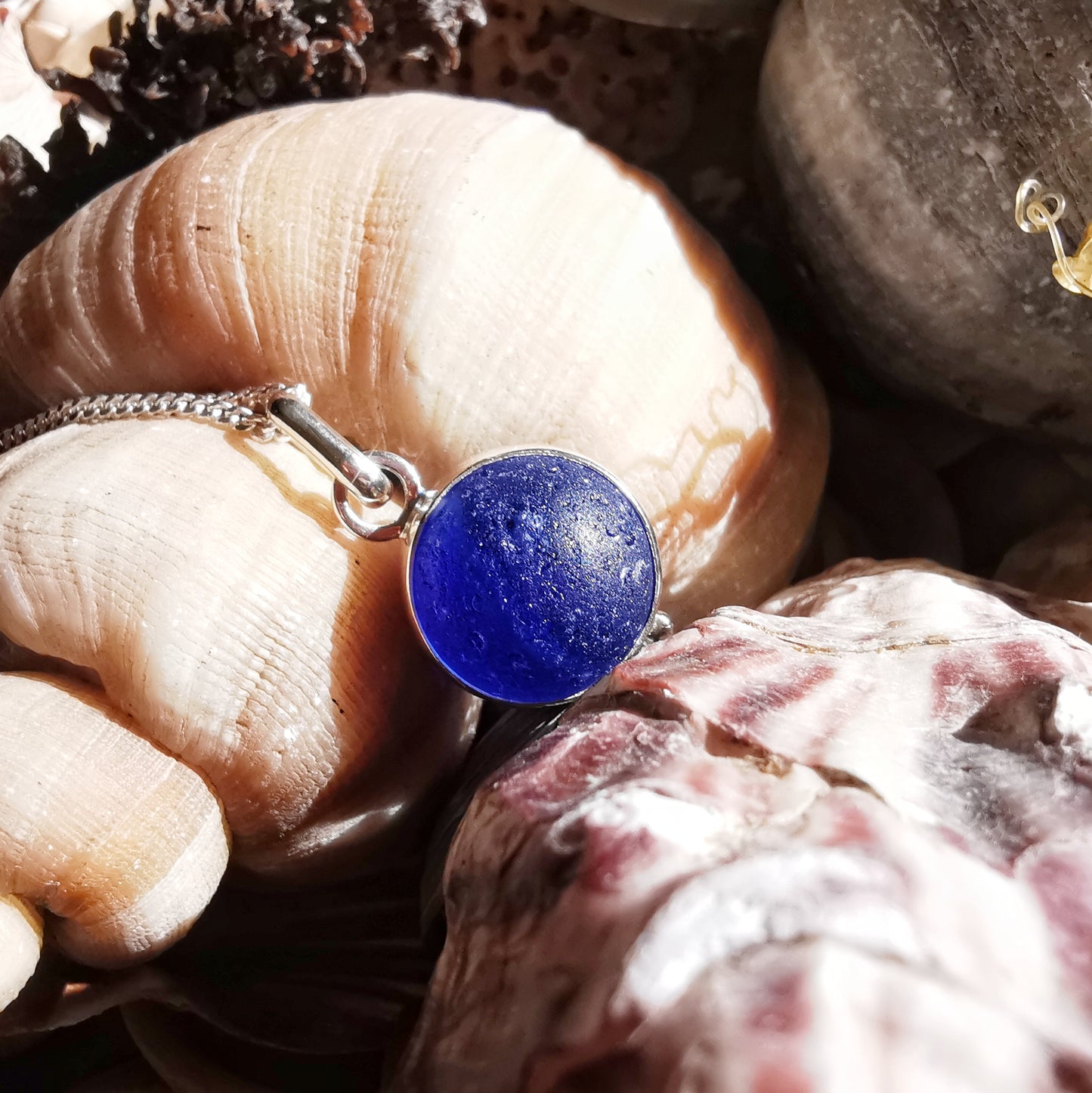 Scottish cobalt blue and white sea glass marble & sterling silver pendant.