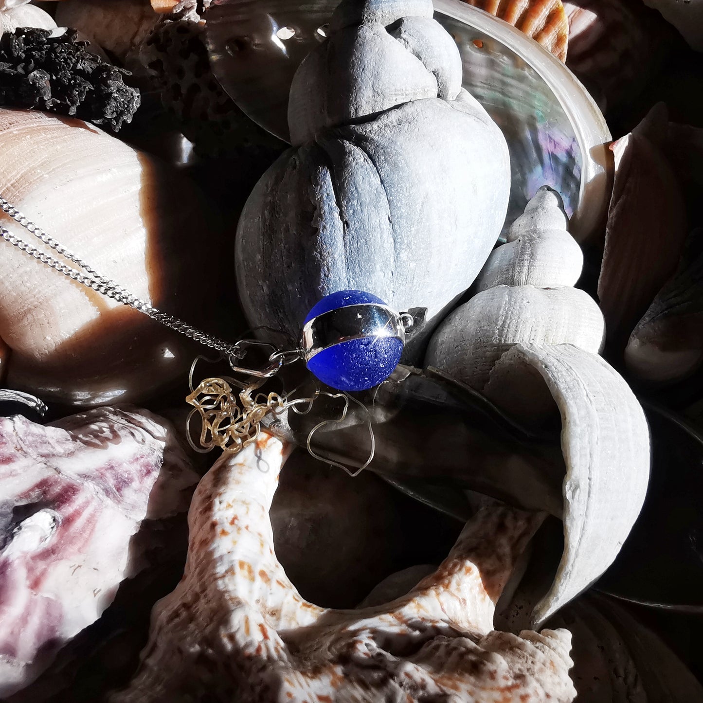 Scottish cobalt blue and white sea glass marble & sterling silver pendant.