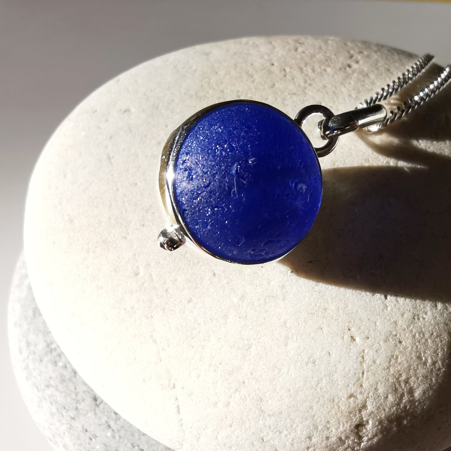 Scottish cobalt blue and white sea glass marble & sterling silver pendant.