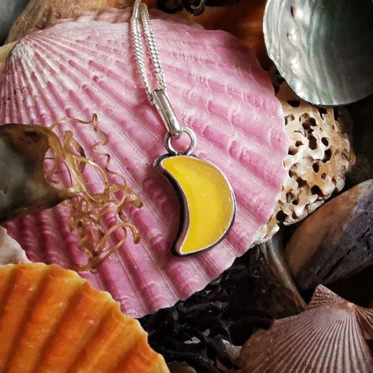 Yellow crescent moon sea glass & sterling silver pendant.