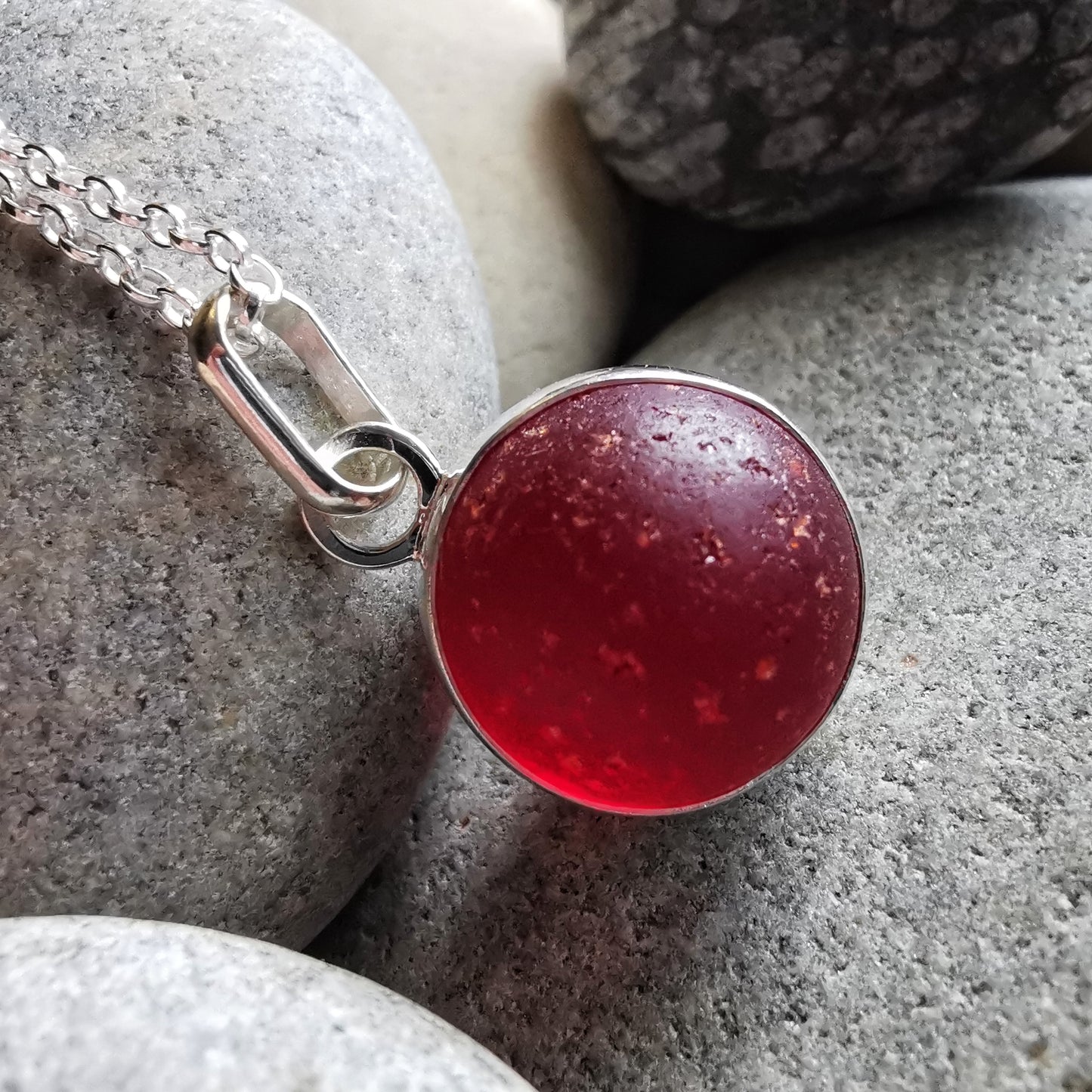 Genuine red sea glass marble & sterling silver pendant.