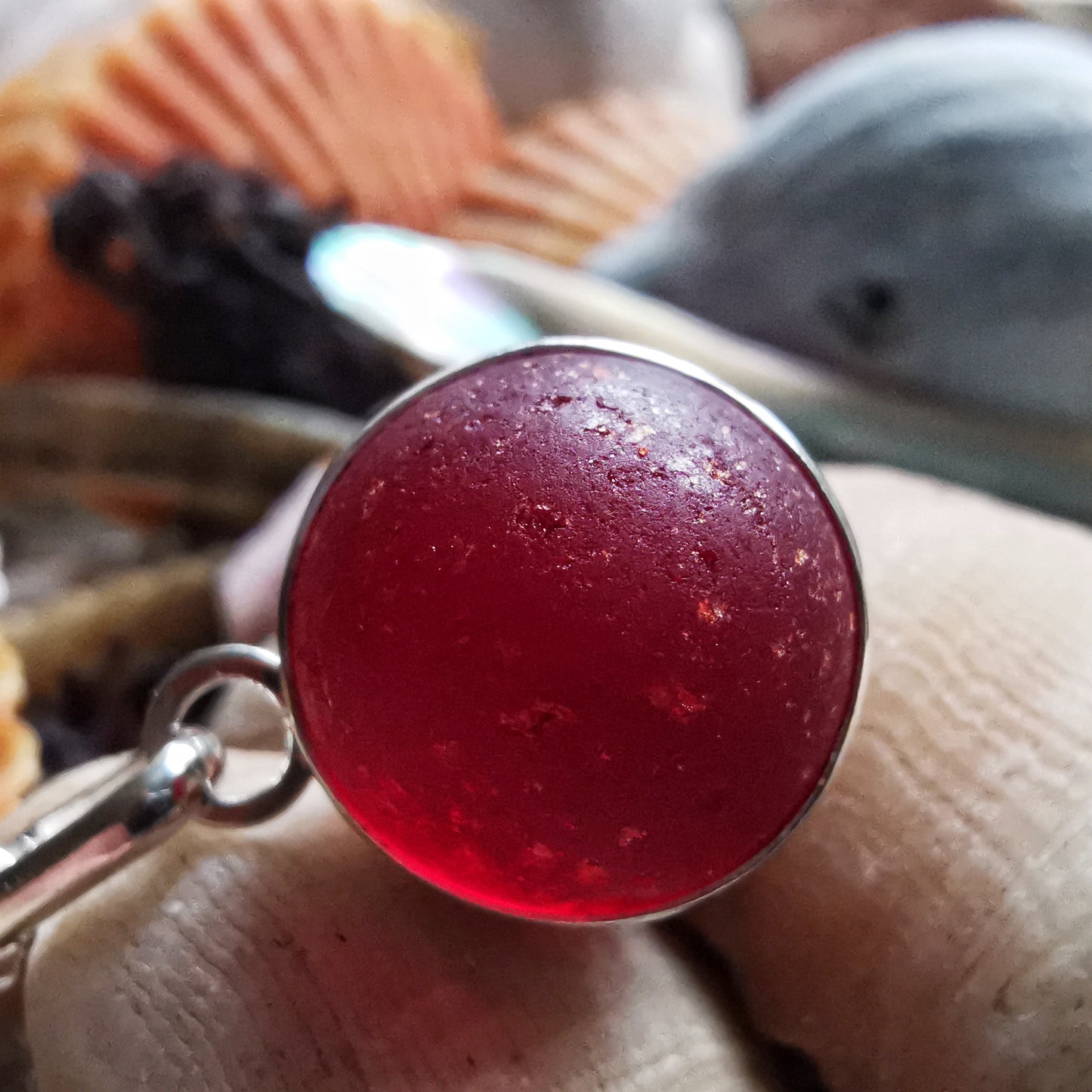 Genuine red sea glass marble & sterling silver pendant.
