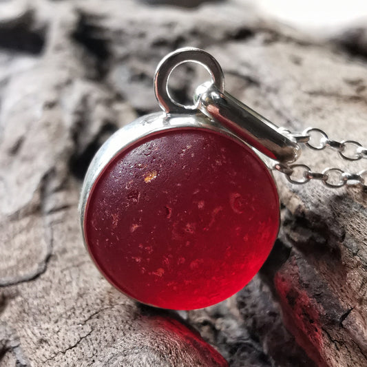 Genuine red sea glass marble & sterling silver pendant.