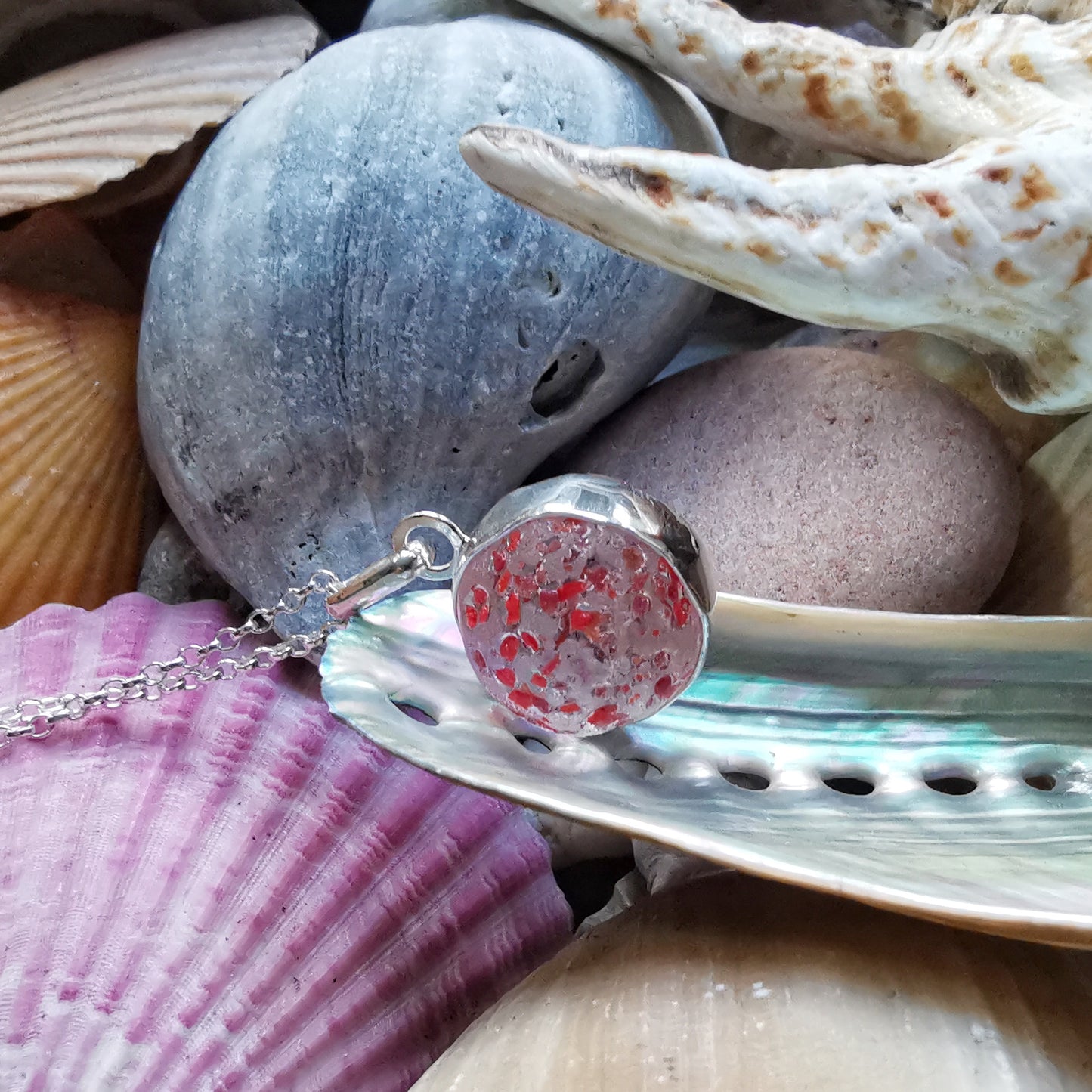 Genuine red speckled confetti sea glass marble & sterling silver pendant.