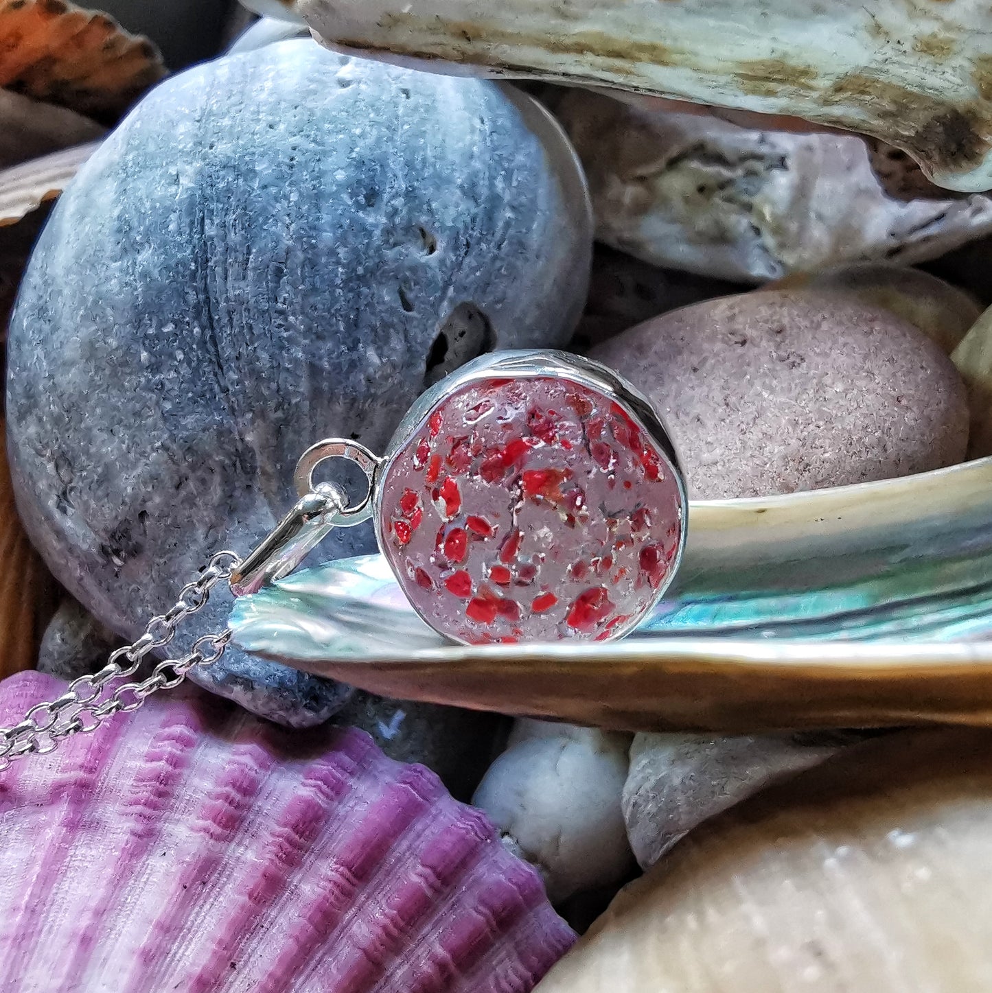 Genuine red speckled confetti sea glass marble & sterling silver pendant.