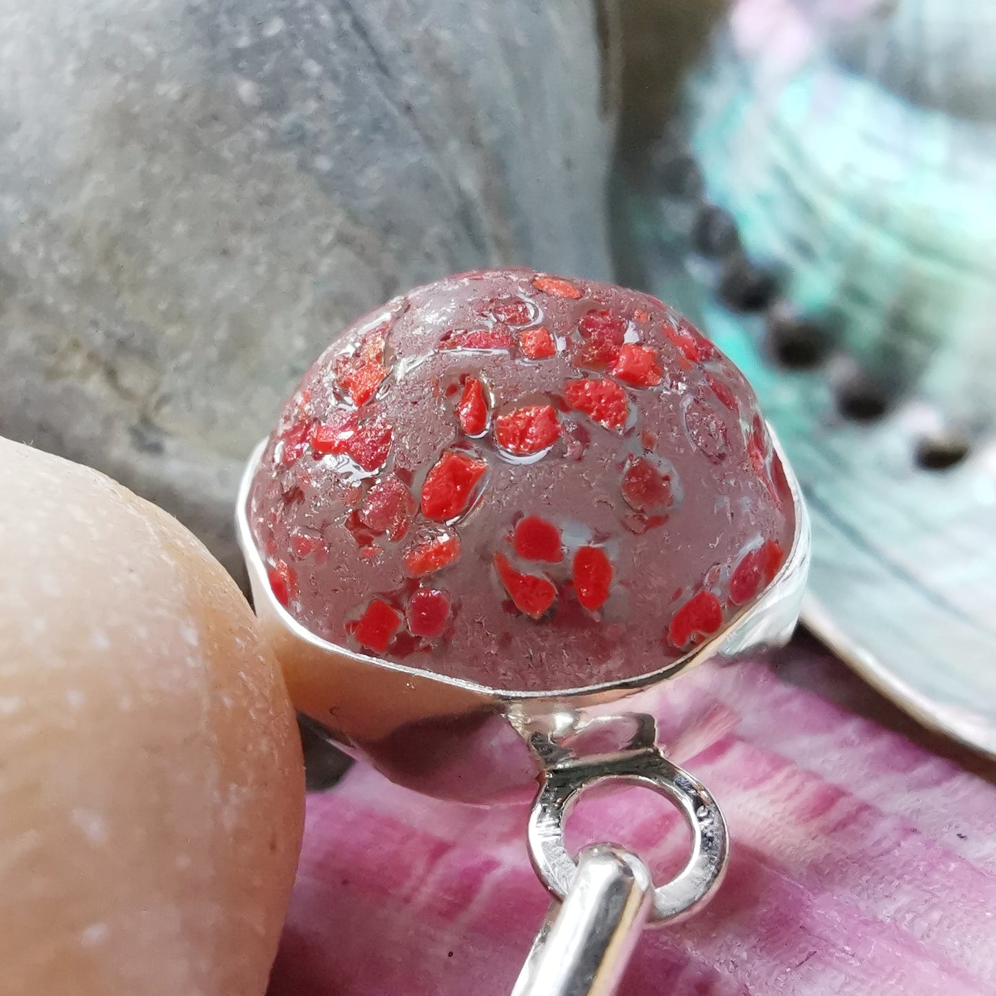Genuine red speckled confetti sea glass marble & sterling silver pendant.