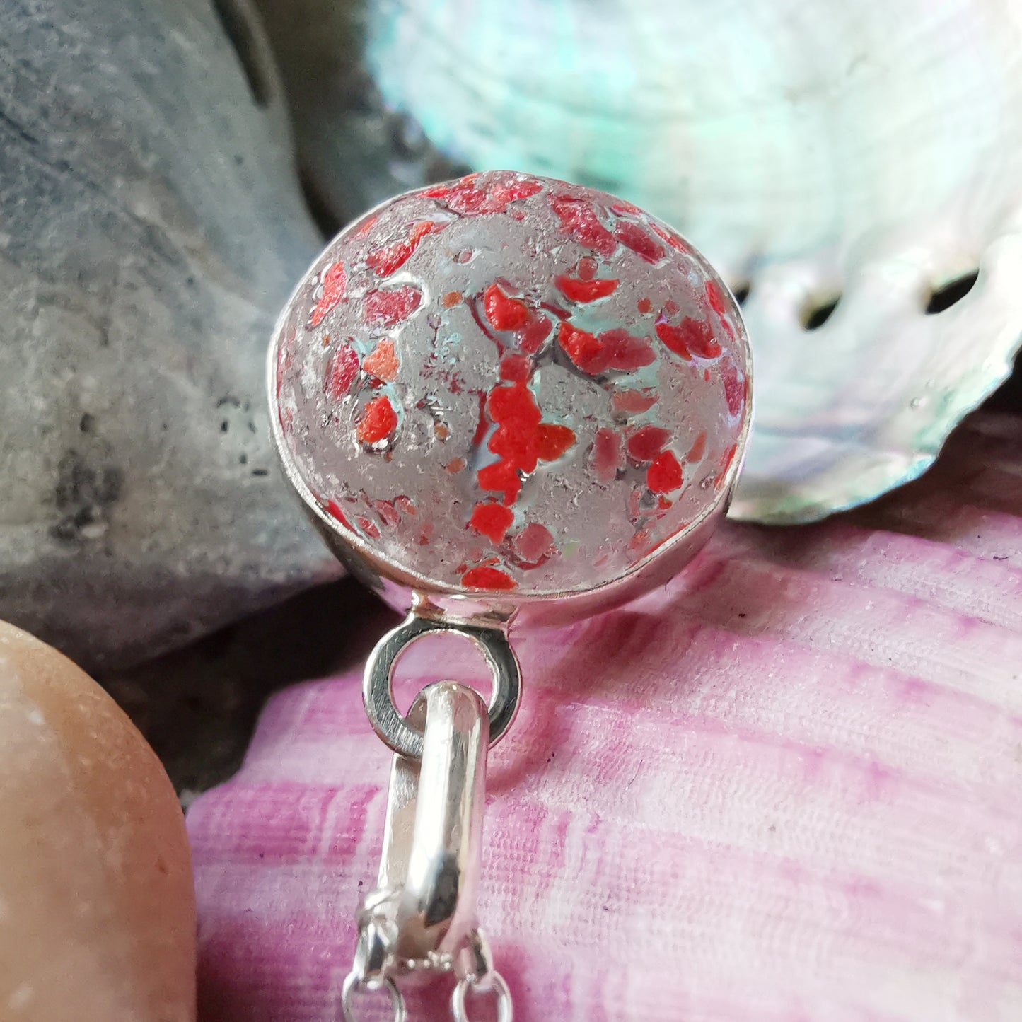 Genuine red speckled confetti sea glass marble & sterling silver pendant.
