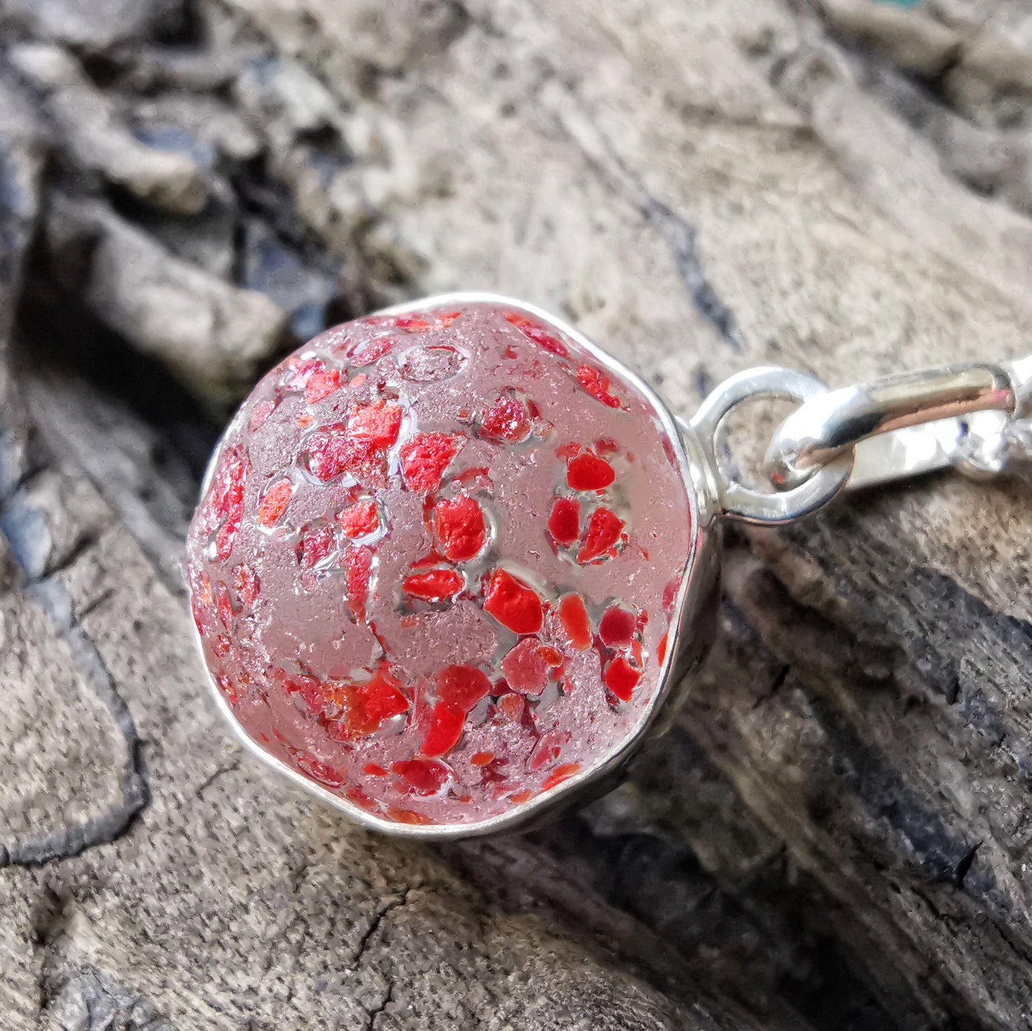 Genuine red speckled confetti sea glass marble & sterling silver pendant.