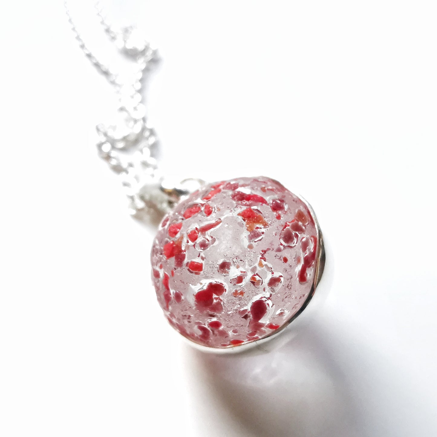 Genuine red speckled confetti sea glass marble & sterling silver pendant.