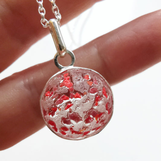 Genuine red speckled confetti sea glass marble & sterling silver pendant.