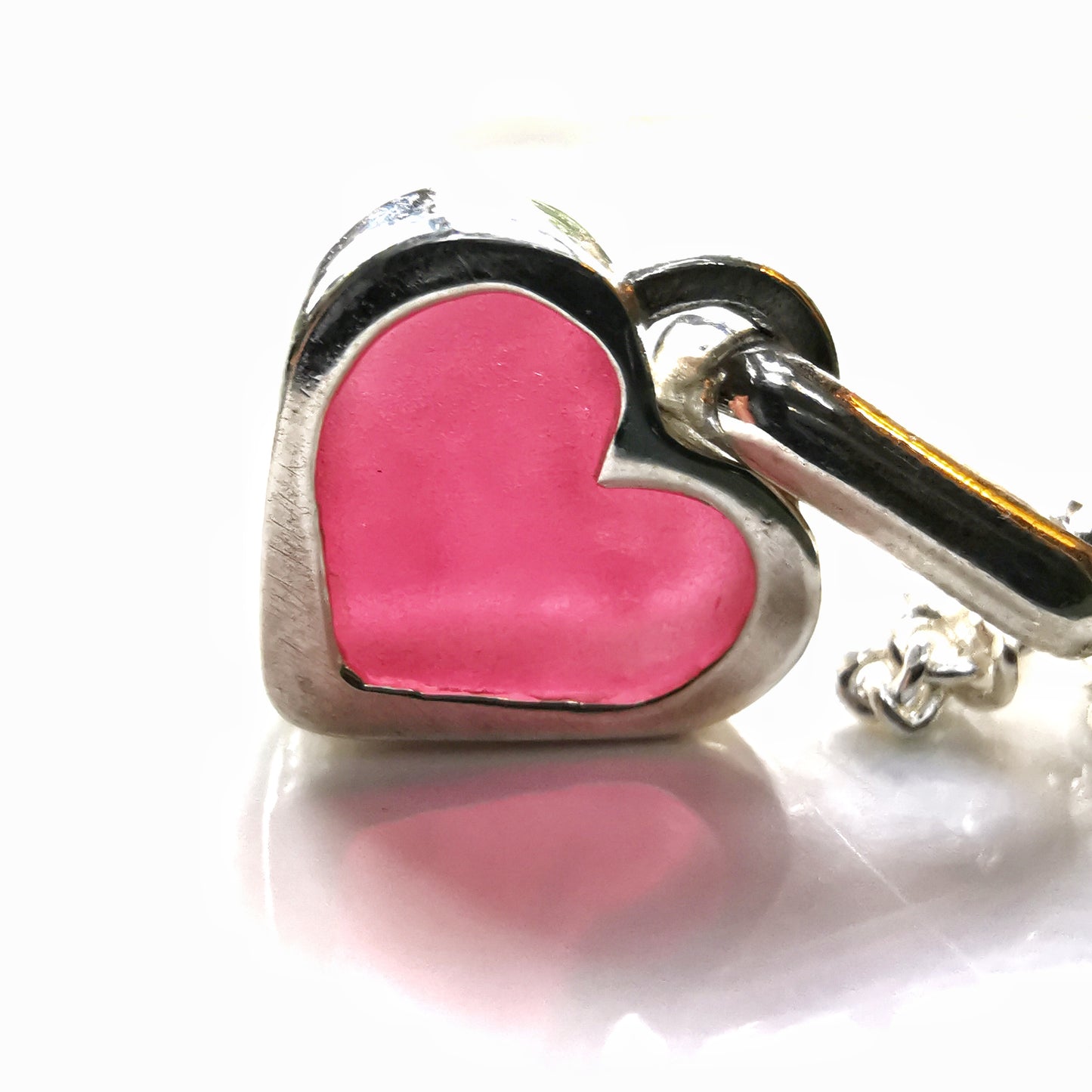 Tiny magenta pink sea glass heart & sterling silver pendant.