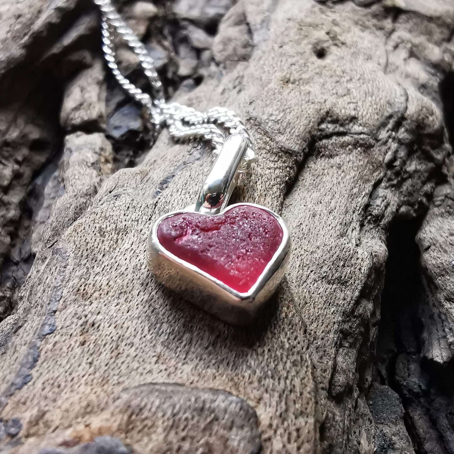 Tiny magenta pink sea glass heart & sterling silver pendant.