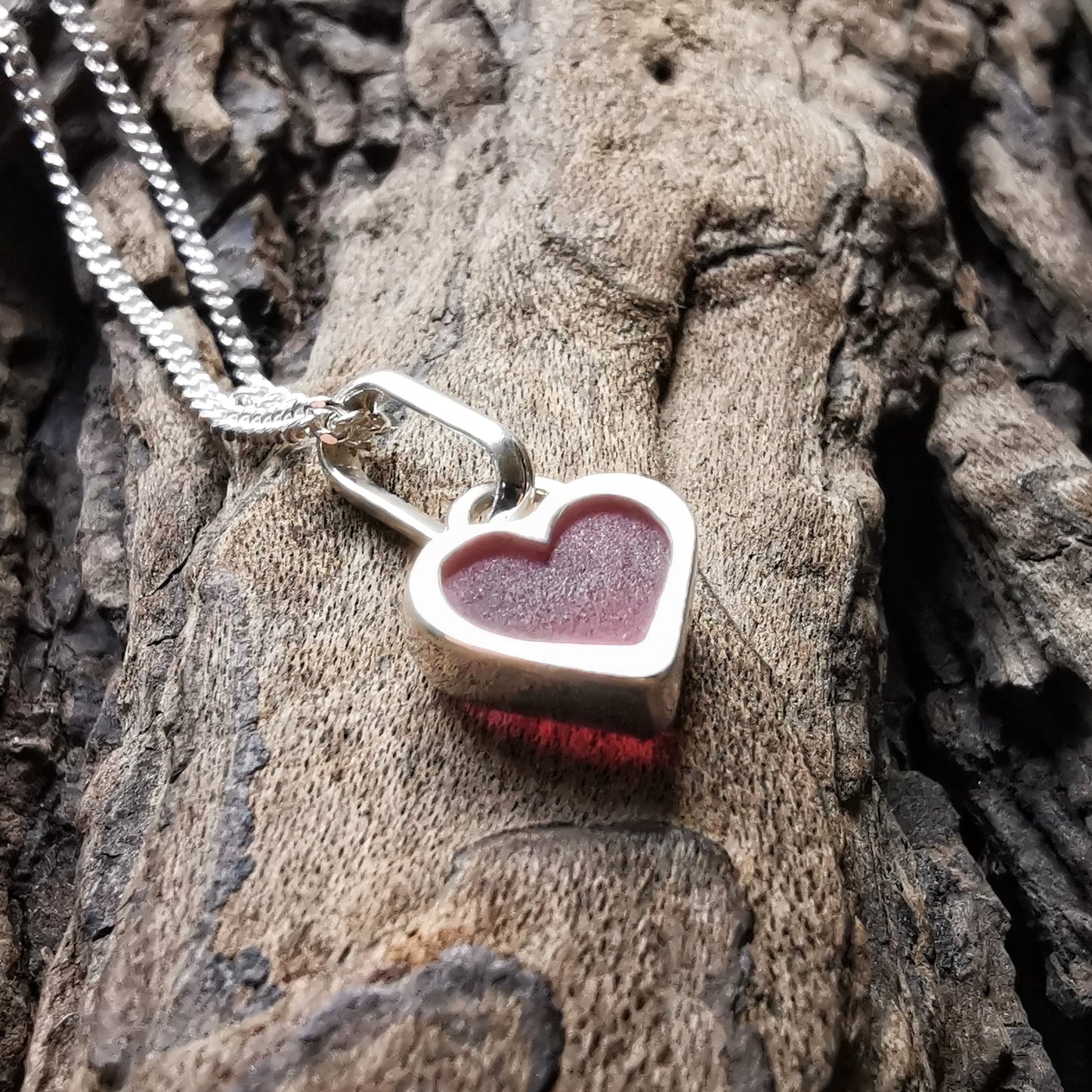 Tiny magenta pink sea glass heart & sterling silver pendant.