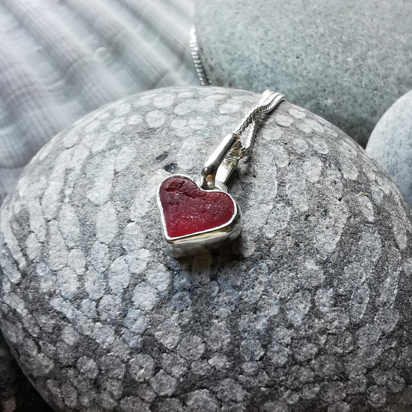 Tiny magenta pink sea glass heart & sterling silver pendant.