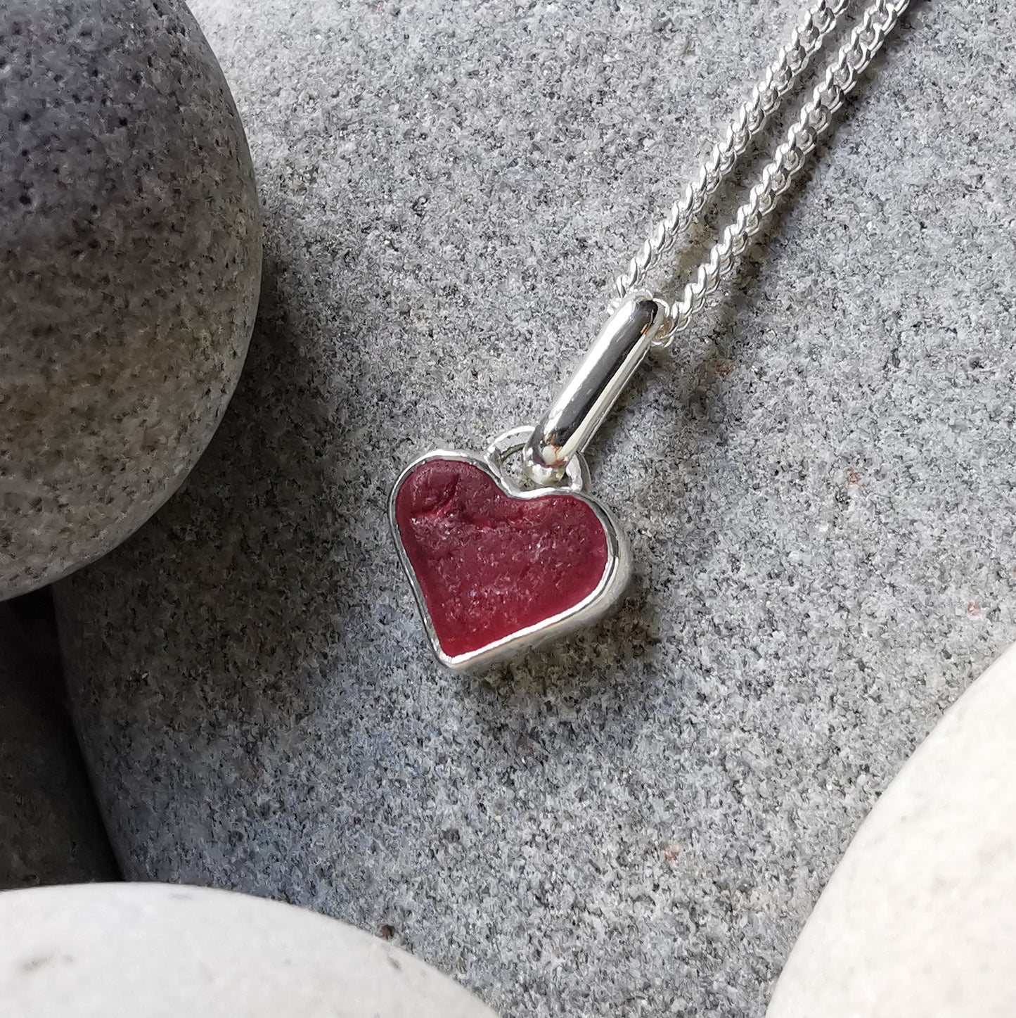 Tiny magenta pink sea glass heart & sterling silver pendant.