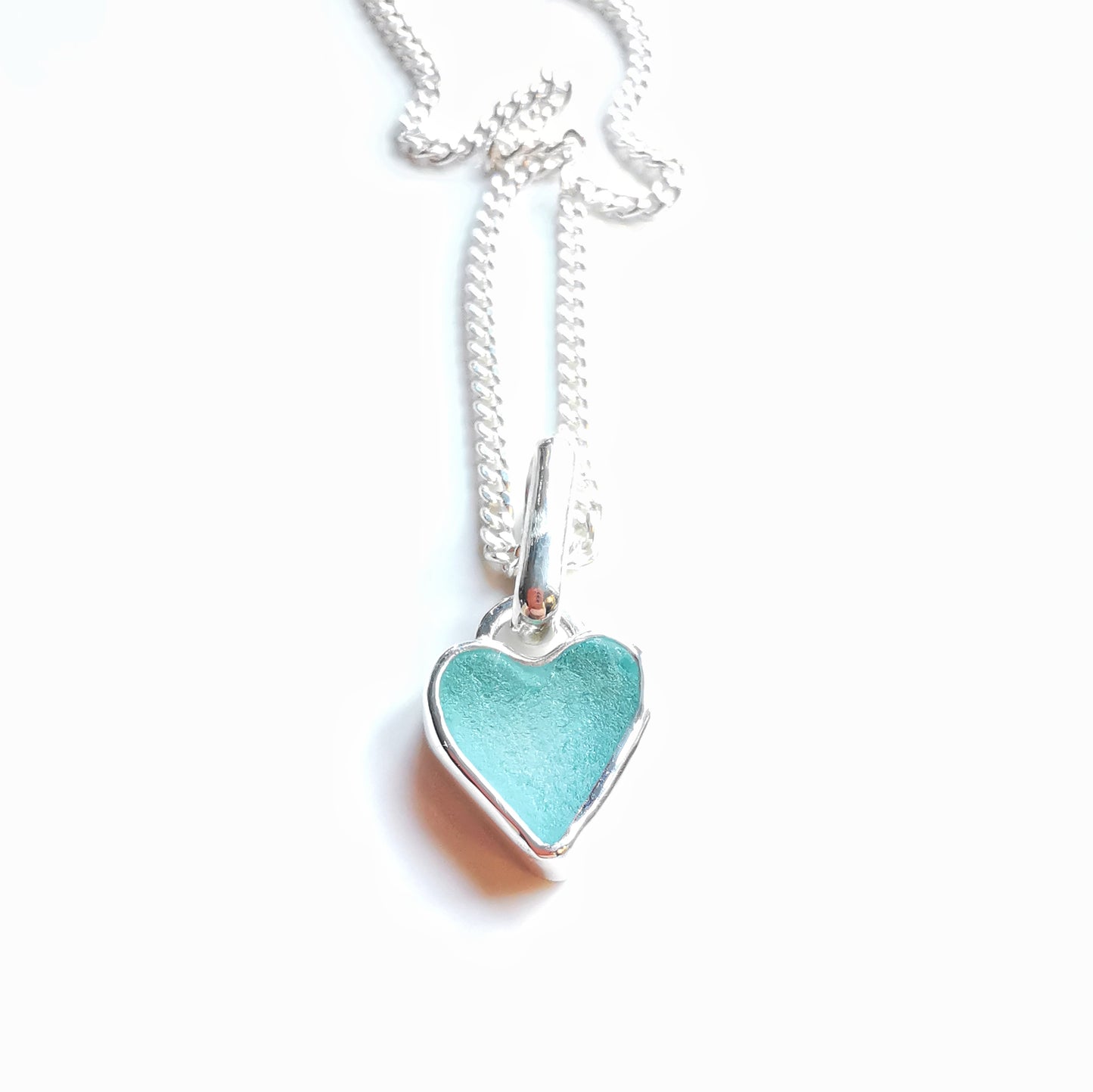 Aqua blue UV sea glass heart  & sterling silver pendant.