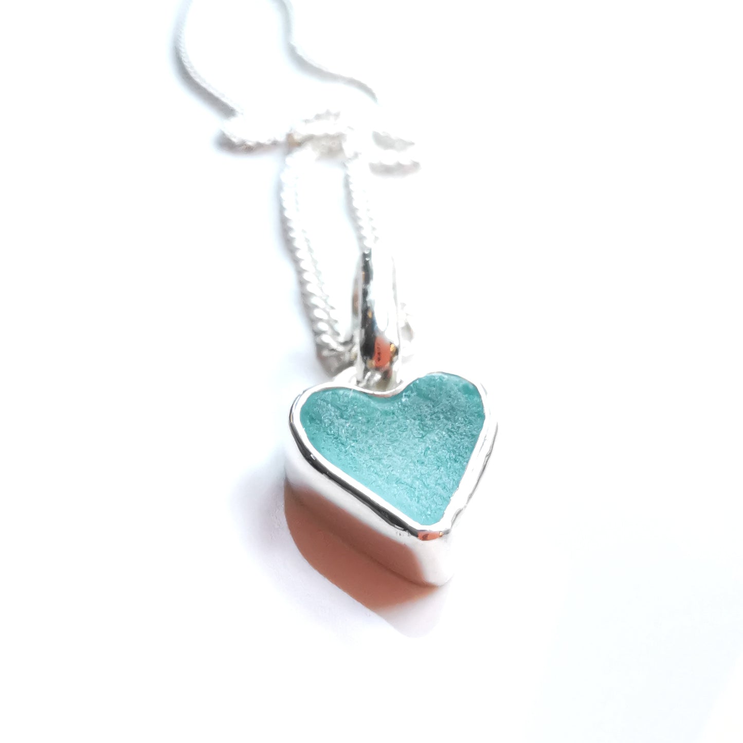 Aqua blue UV sea glass heart  & sterling silver pendant.