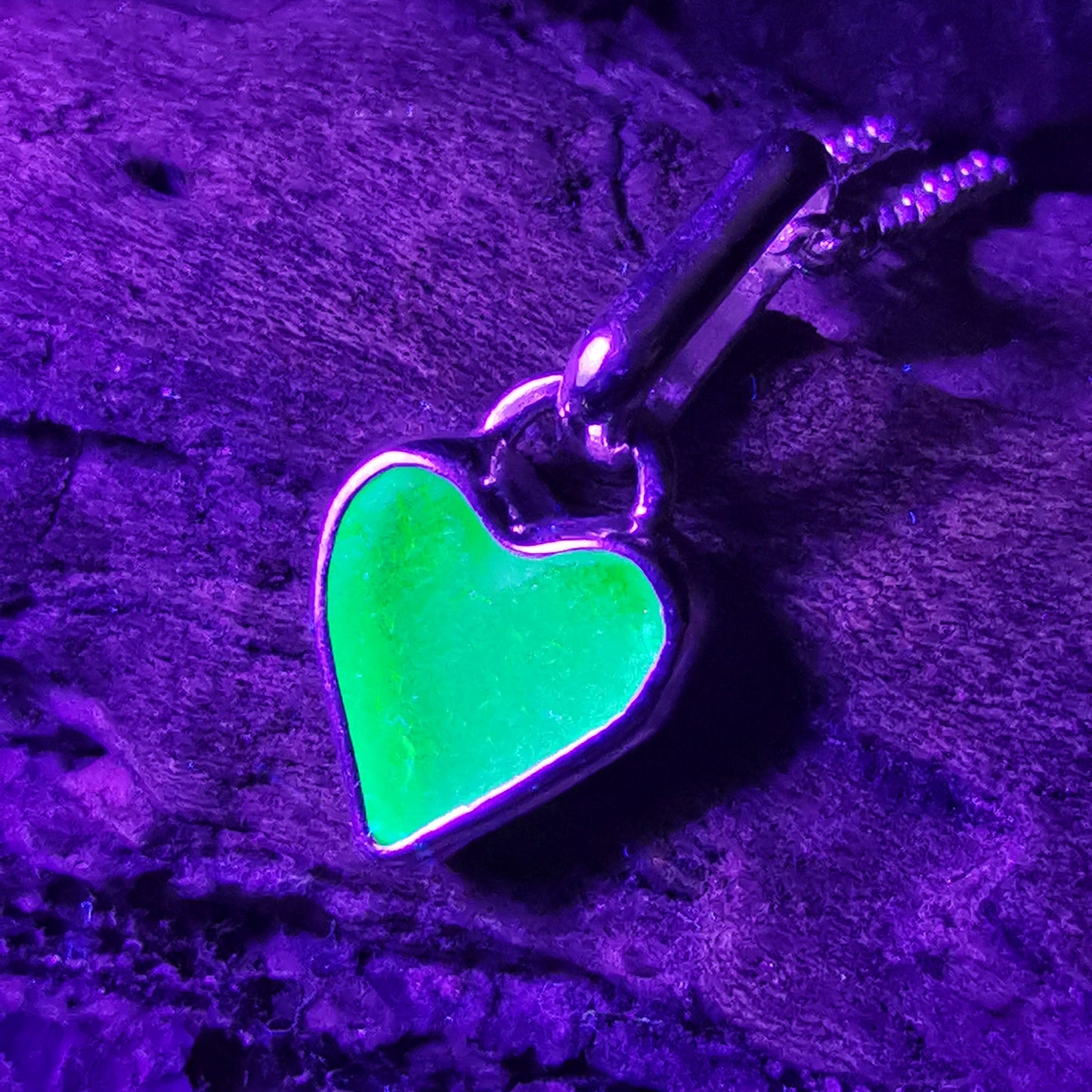 Aqua blue UV sea glass heart  & sterling silver pendant.