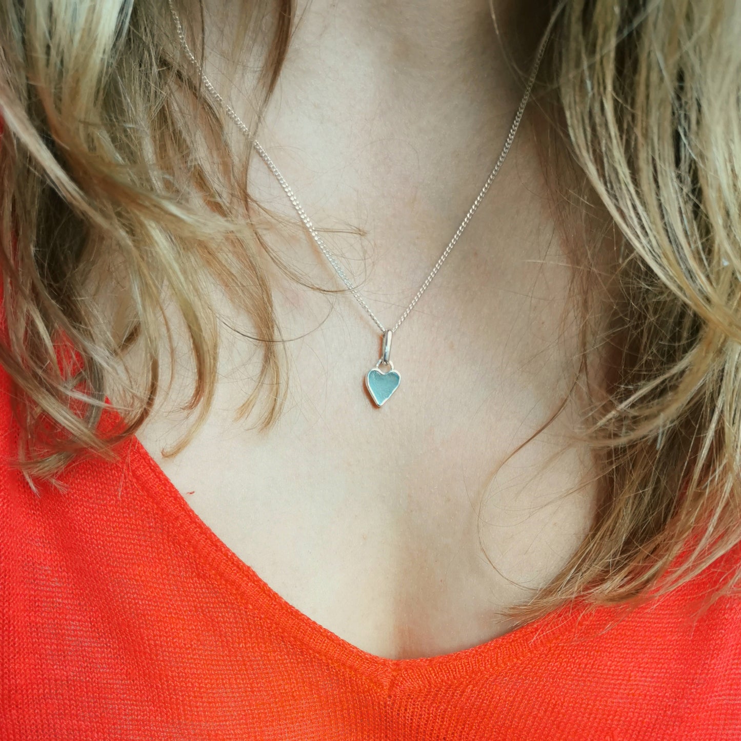 Aqua blue UV sea glass heart  & sterling silver pendant.