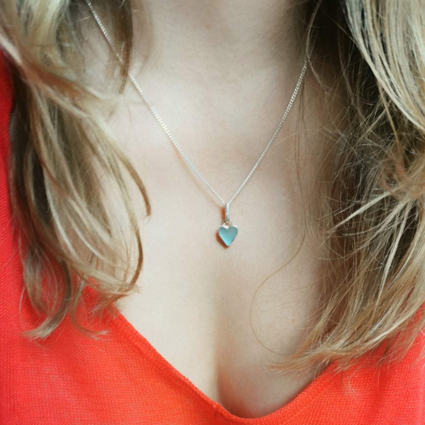 Aqua blue UV sea glass heart  & sterling silver pendant.