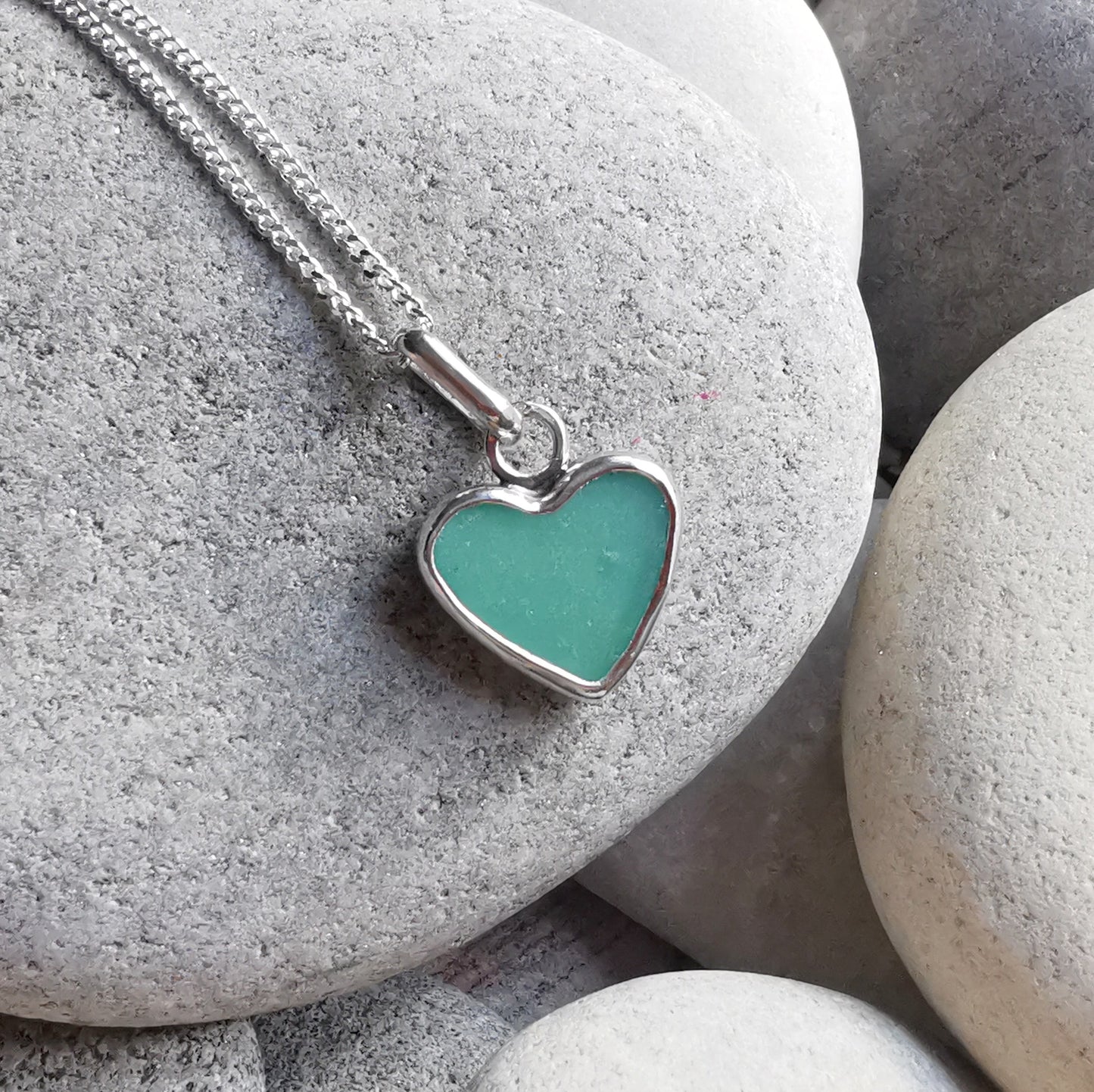 Teal green sea glass heart & sterling silver pendant.