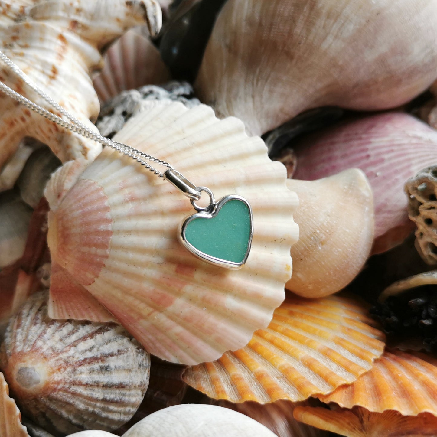 Teal green sea glass heart & sterling silver pendant.