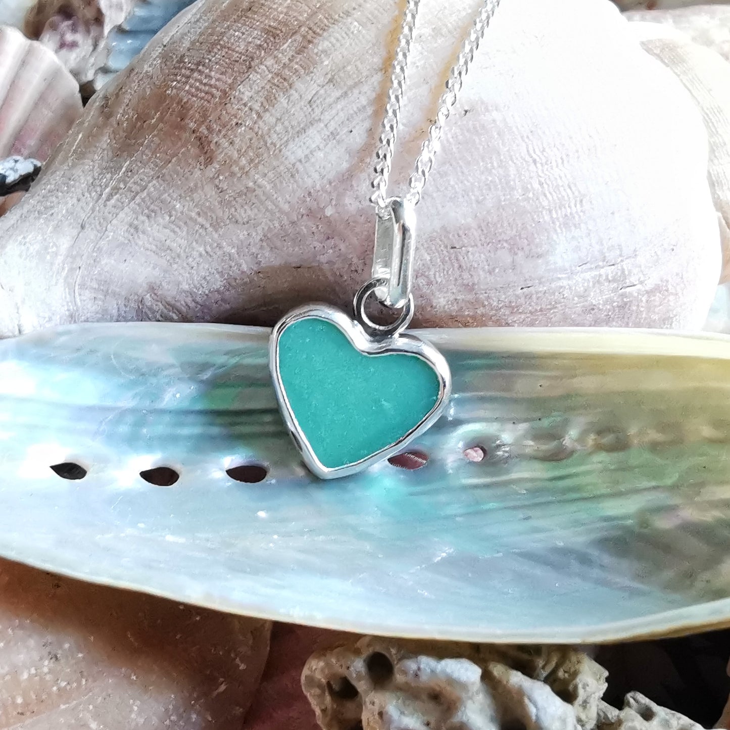 Teal green sea glass heart & sterling silver pendant.