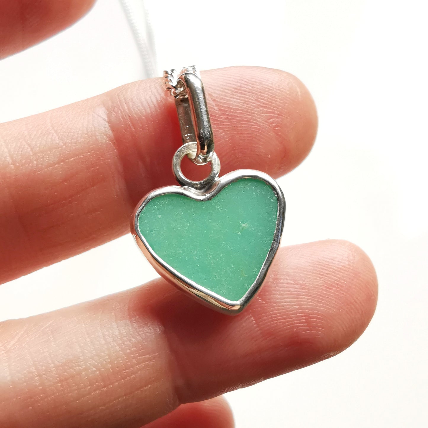 Teal green sea glass heart & sterling silver pendant.
