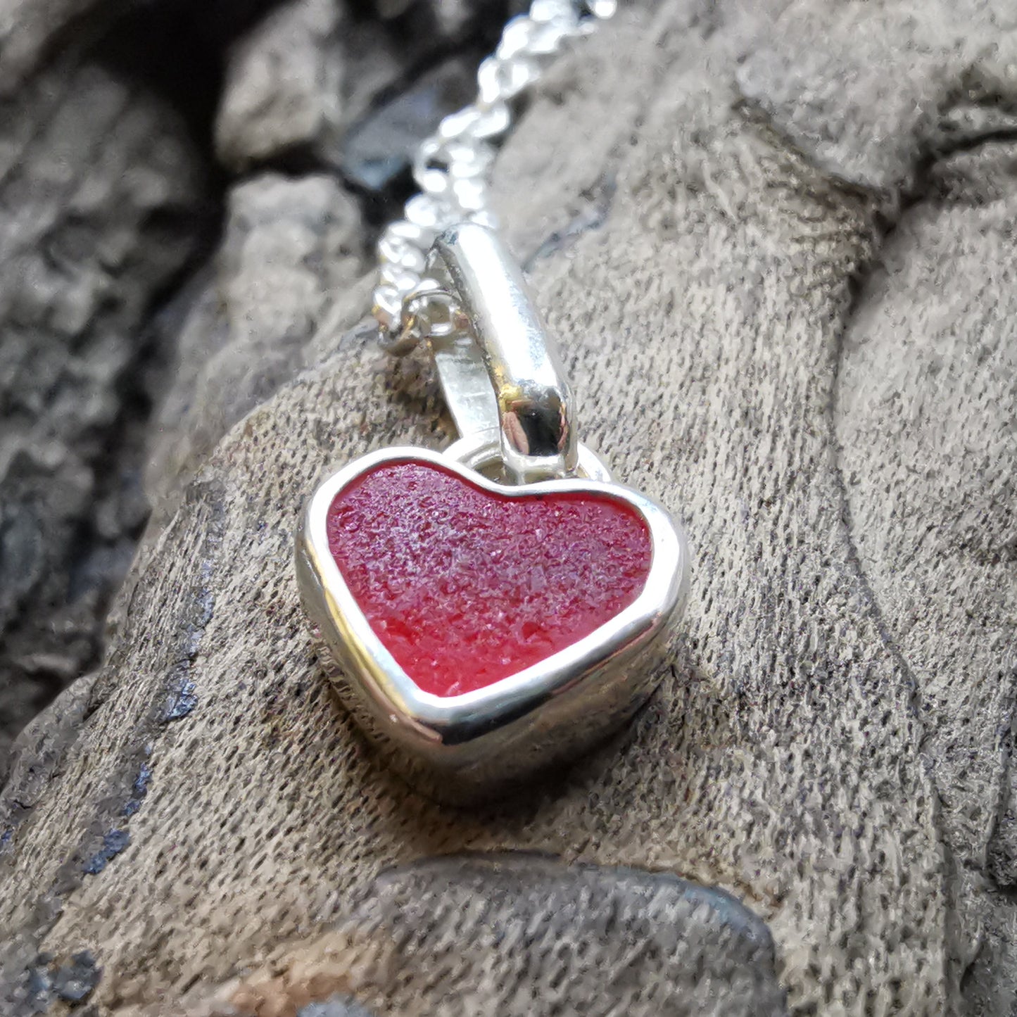 Tiny Scottish UV red sea glass heart & sterling silver pendant.