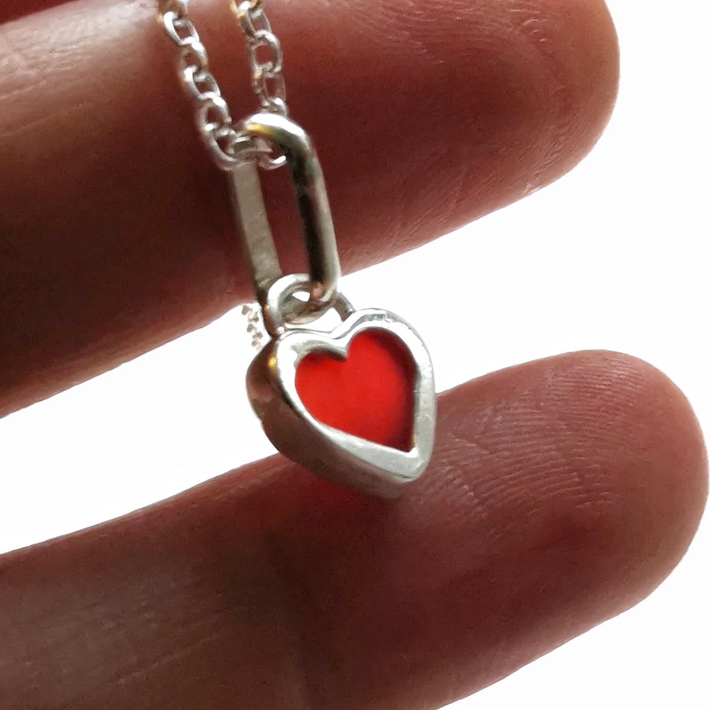 Tiny Scottish UV red sea glass heart & sterling silver pendant.