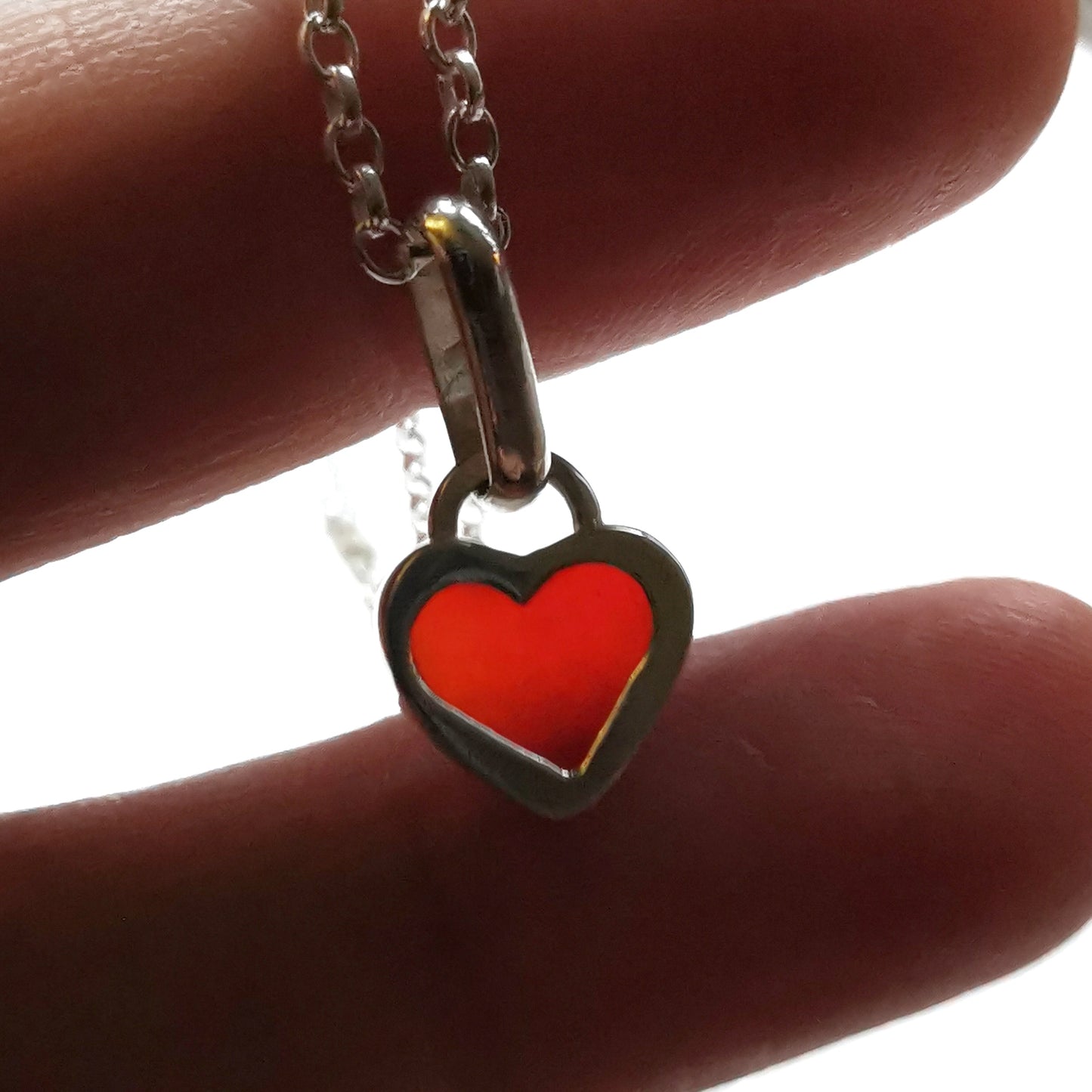 Tiny Scottish UV red sea glass heart & sterling silver pendant.