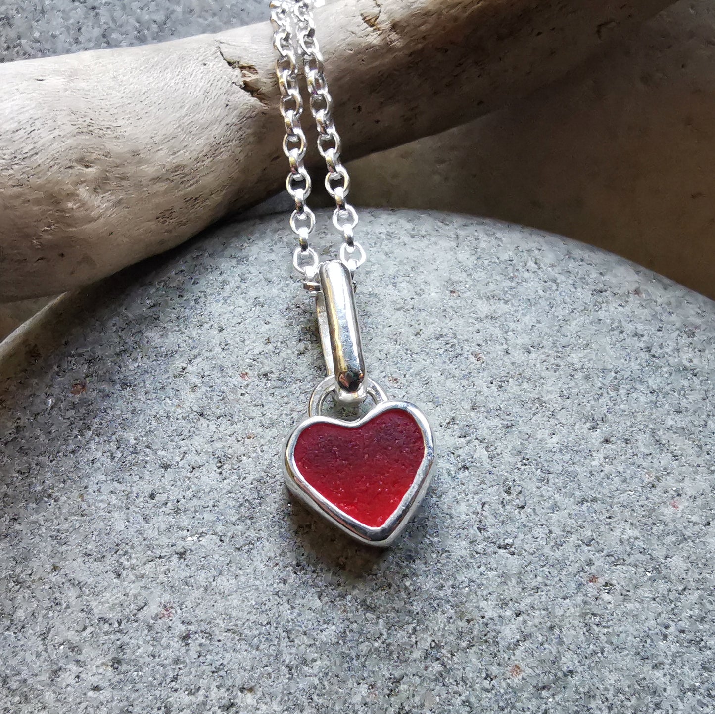 Tiny Scottish UV red sea glass heart & sterling silver pendant.