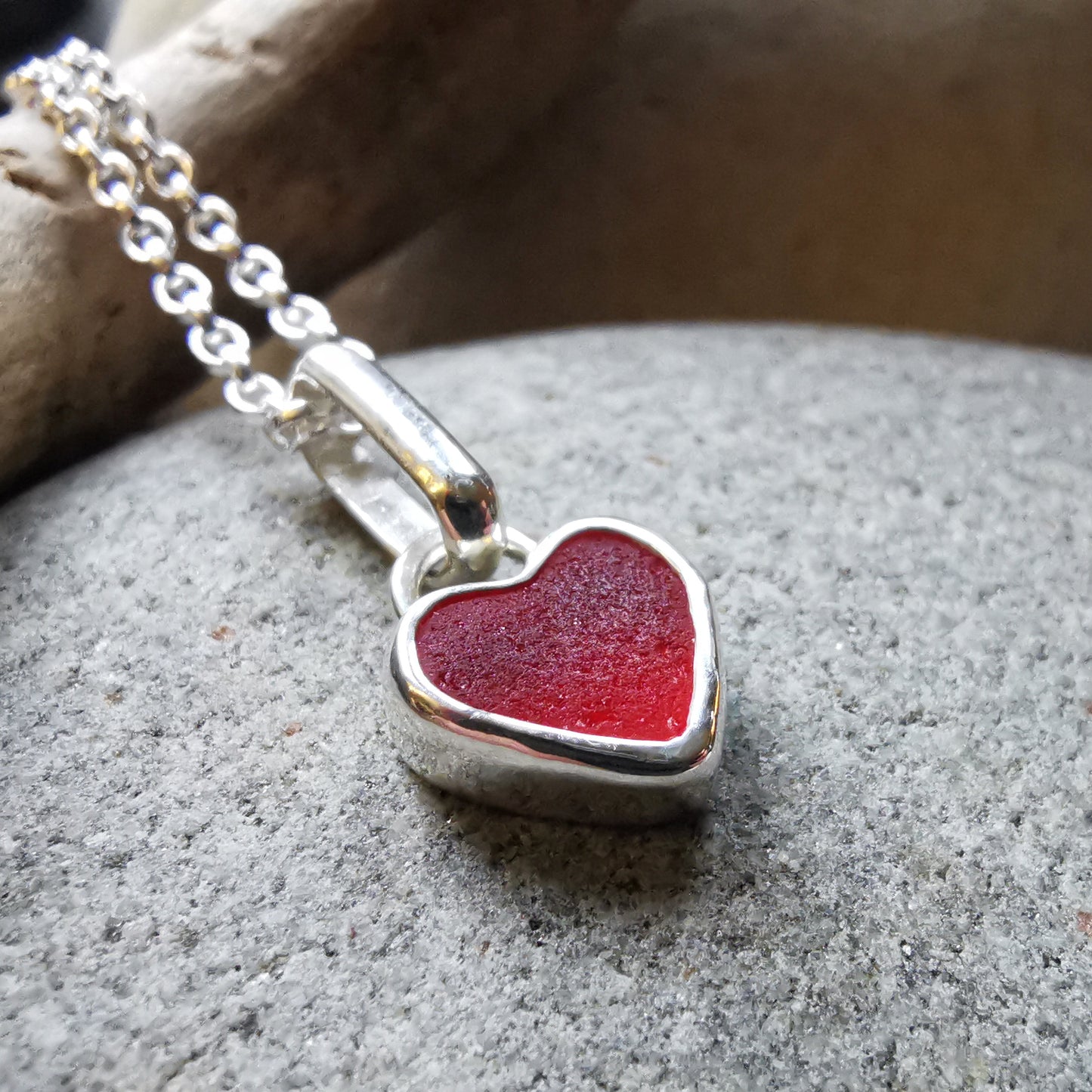 Tiny Scottish UV red sea glass heart & sterling silver pendant.