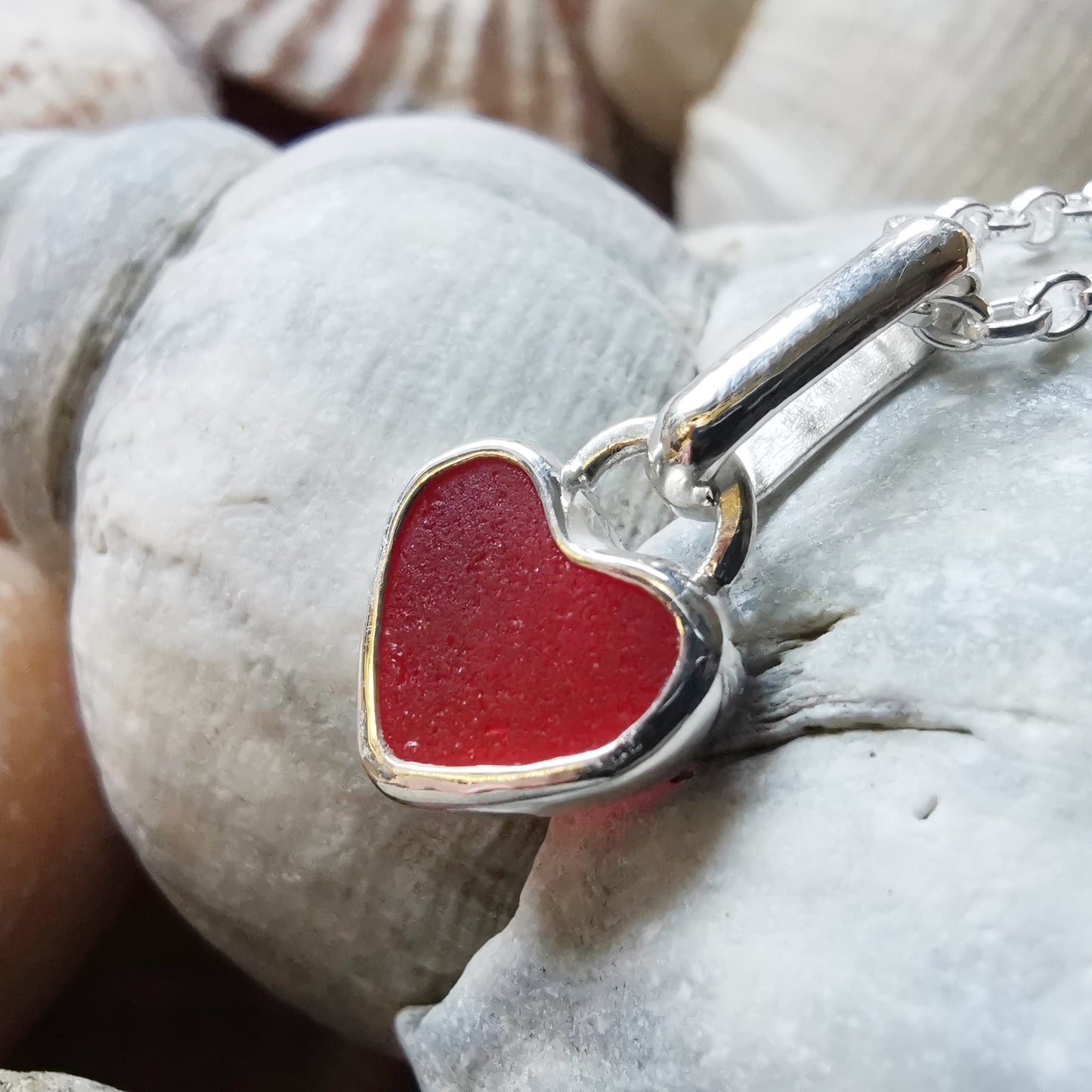 Tiny Scottish UV red sea glass heart & sterling silver pendant.