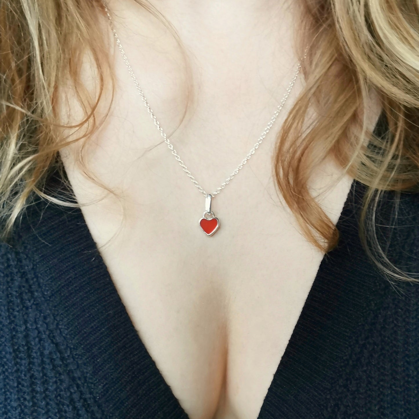 Tiny Scottish UV red sea glass heart & sterling silver pendant.