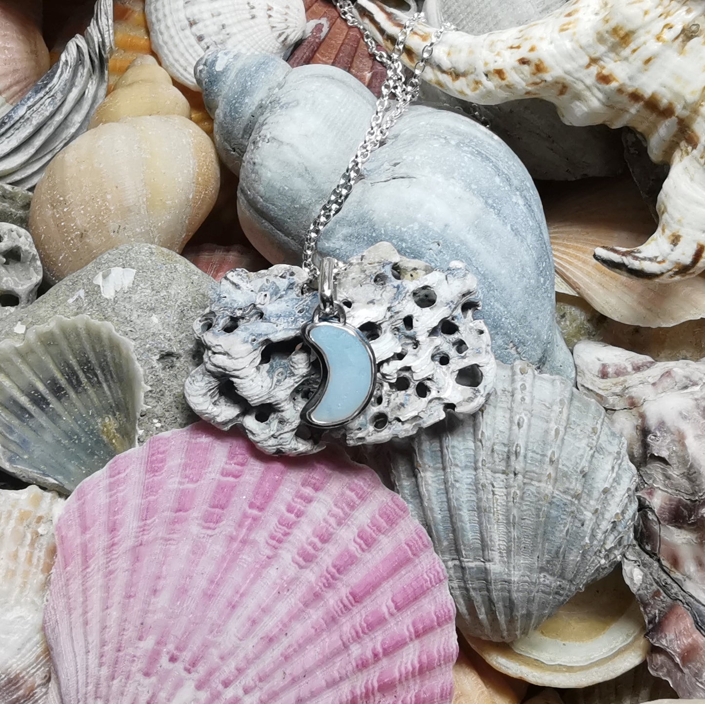 Opalescent crescent moon sea glass & sterling silver pendant.