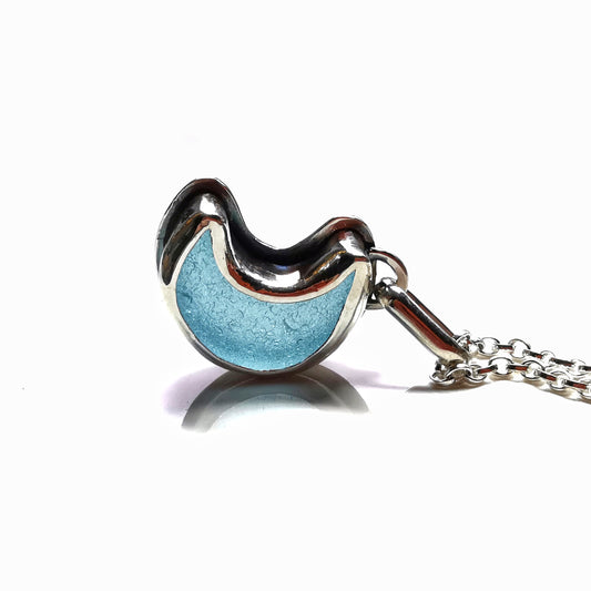 Aqua crescent moon sea glass & sterling silver pendant.