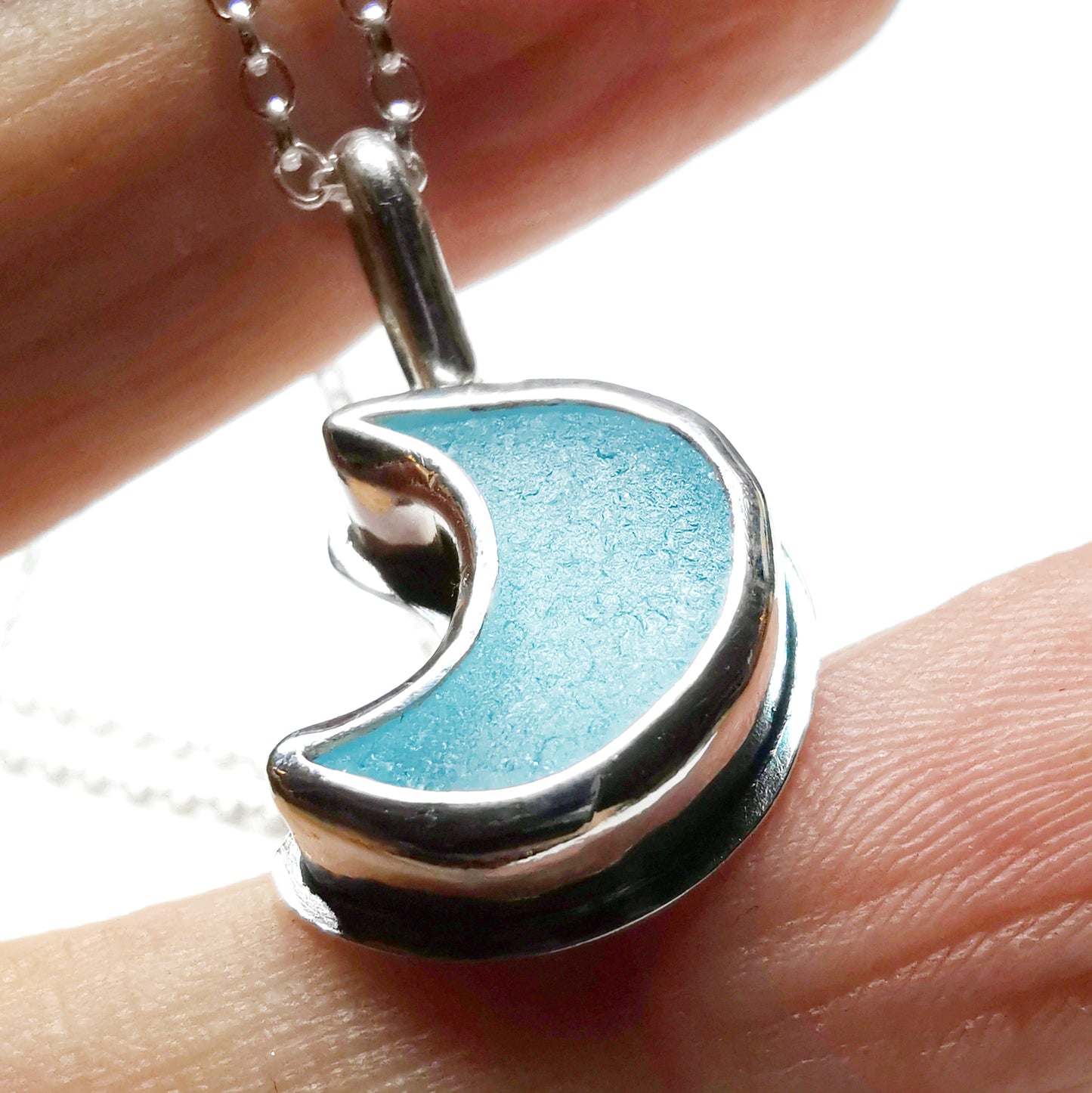 Aqua crescent moon sea glass & sterling silver pendant.