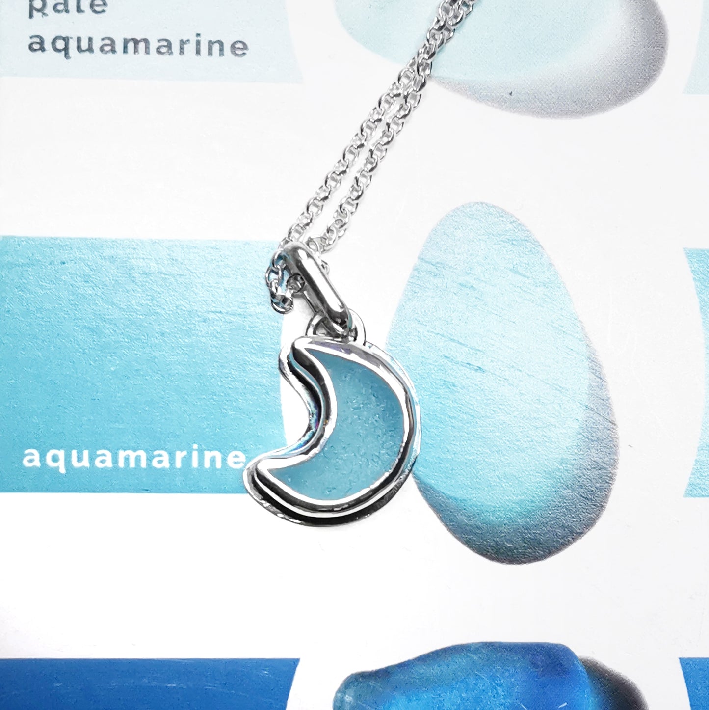 Aqua crescent moon sea glass & sterling silver pendant.