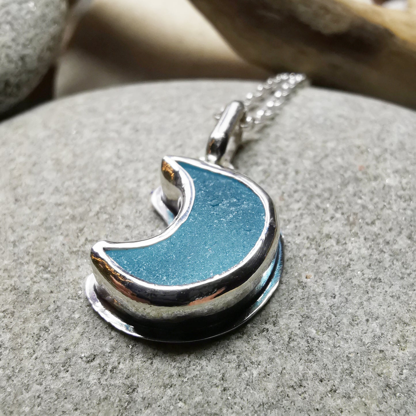 Aqua crescent moon sea glass & sterling silver pendant.
