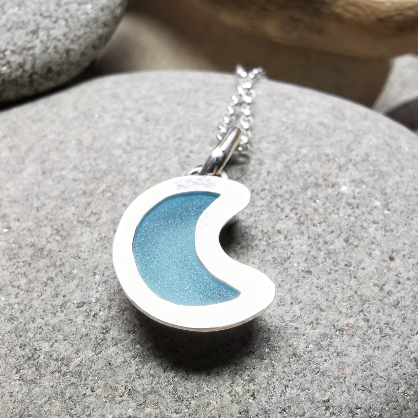 Aqua crescent moon sea glass & sterling silver pendant.